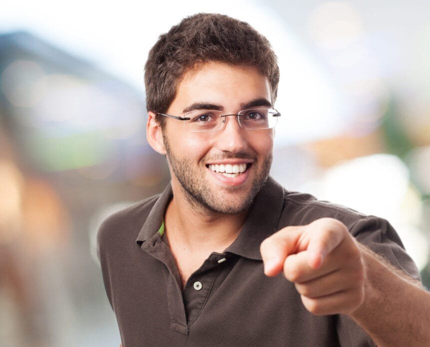 portrait of handsome young man pointing to the front